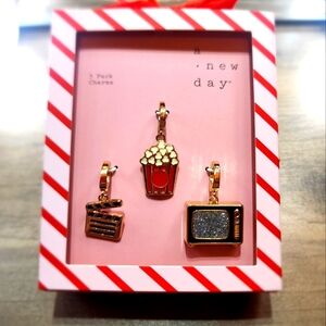 A New Day Gold Charm Set.             **BRAND NEW IN BOX**